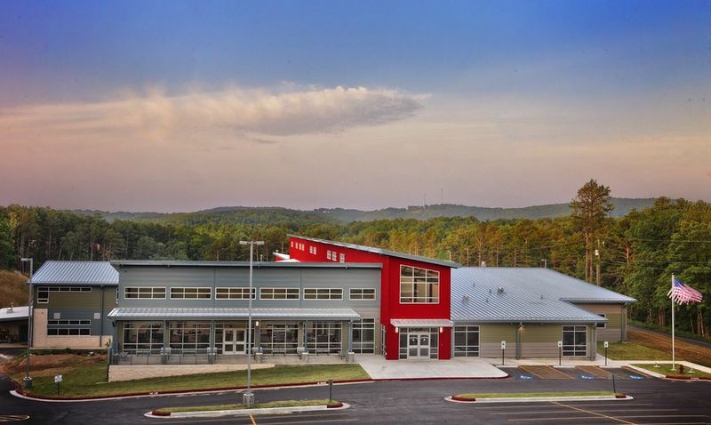 Image of school roof with standing seam metal roof panels installed by A-Lert Roof Systems